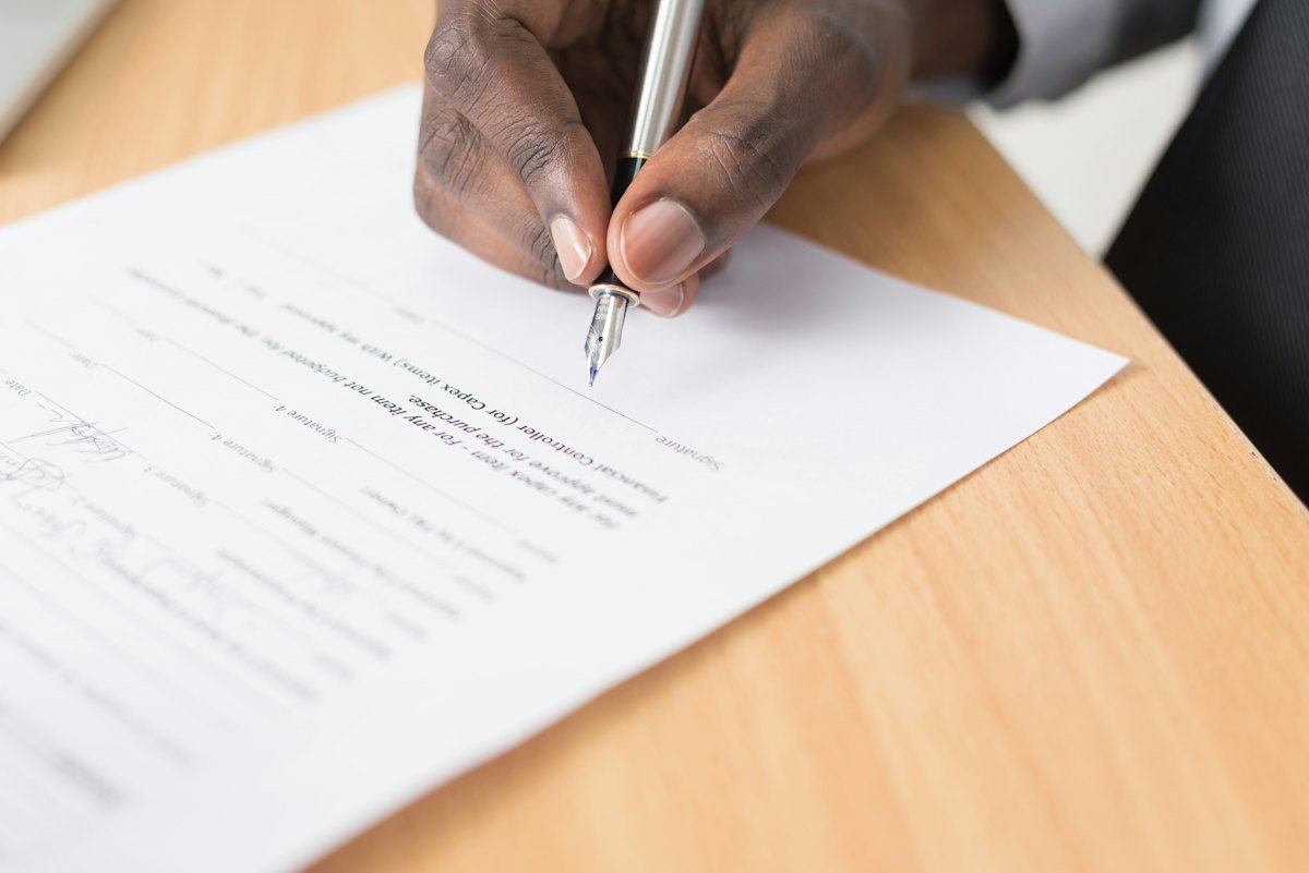 Candidate signing an employment offer letter
